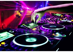 Dj mixer with headphones at nightclub (1)